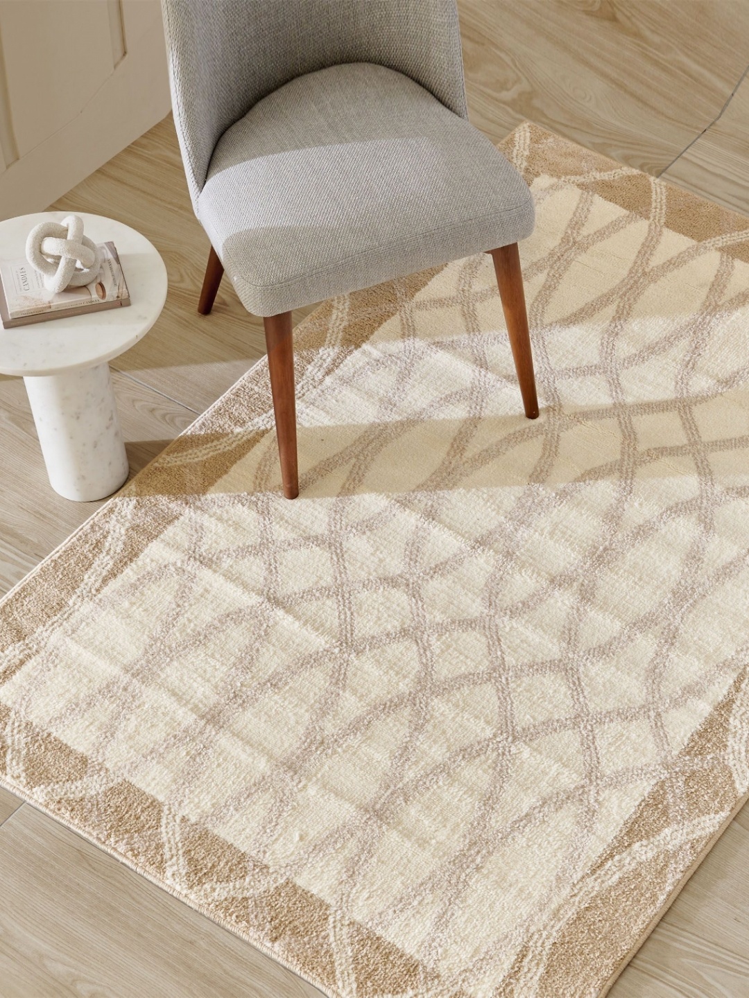 

Home Centre Savanna Vector Beige & Off White Geometric Printed Knitted Carpet