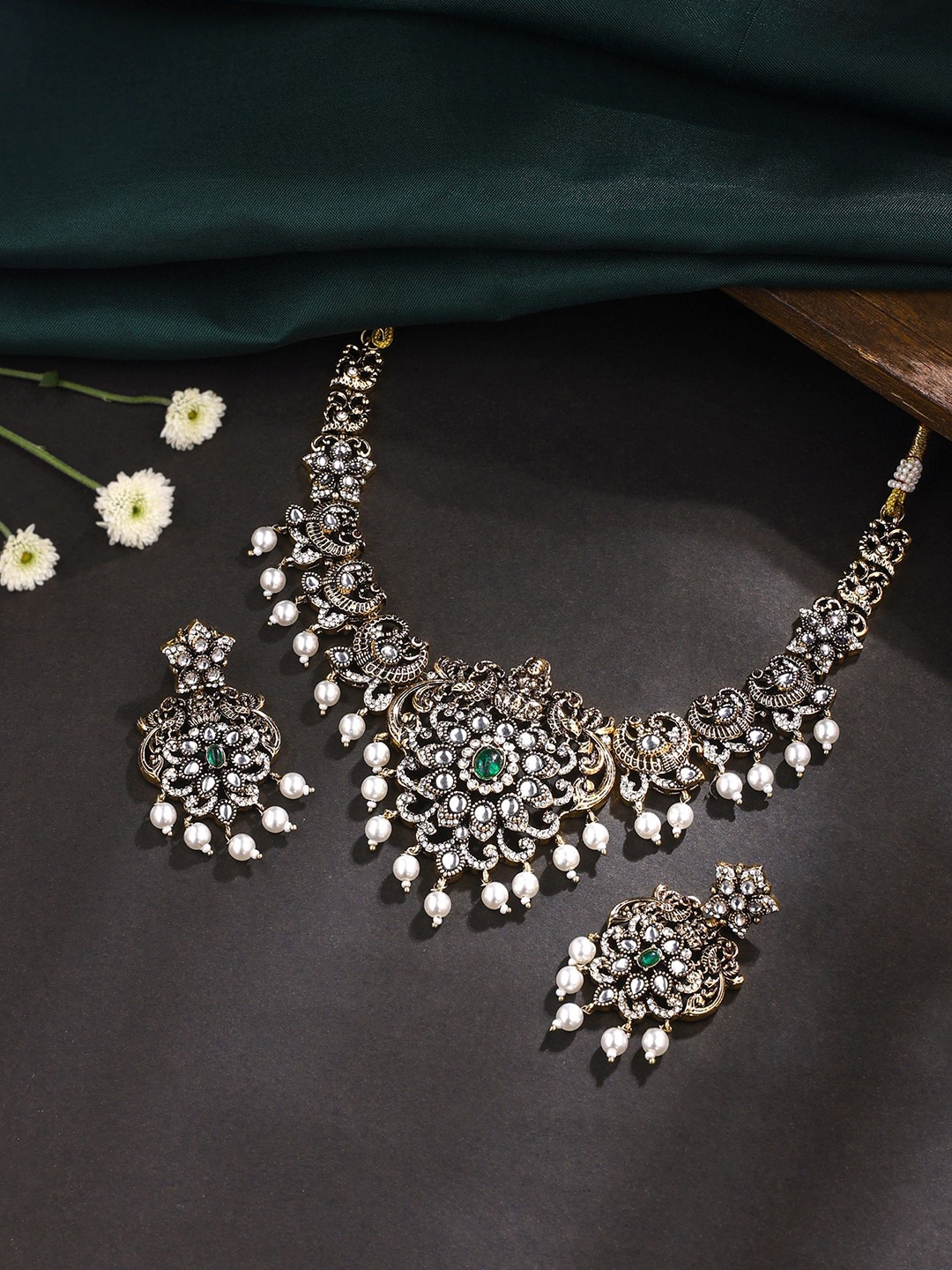 

Yellow Chimes Gold-Plated Stone-Studded & Pearls Beaded Lakshmi Goddess Jewellery Set