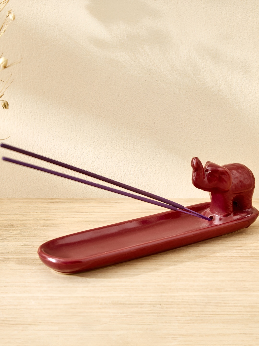 

Home Centre Garnet Serene Red Ceramic Elephant Incense Stick Holder