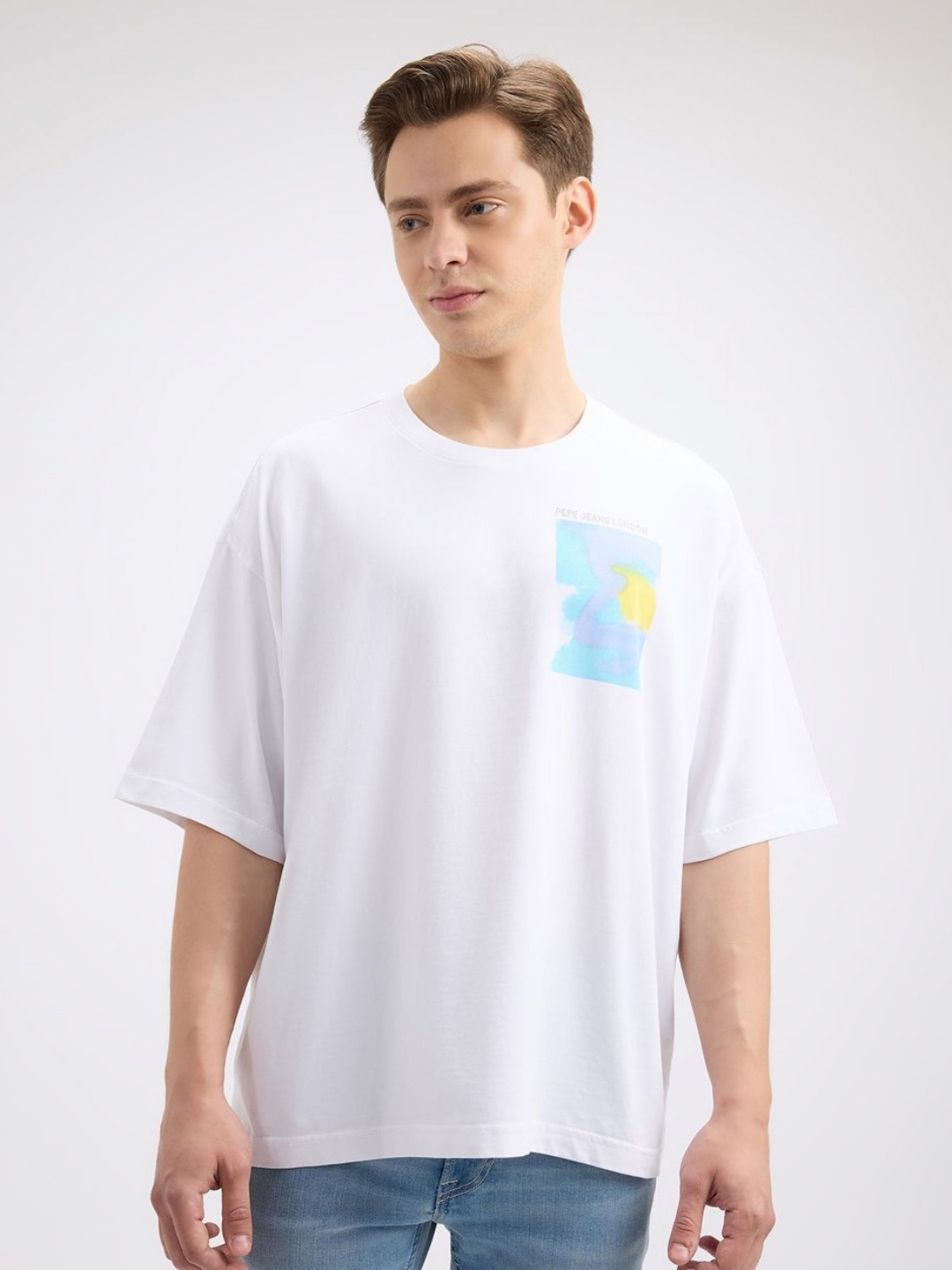 

Pepe Jeans Men Graphic Printed Round Neck Cotton Oversized T-shirt, White