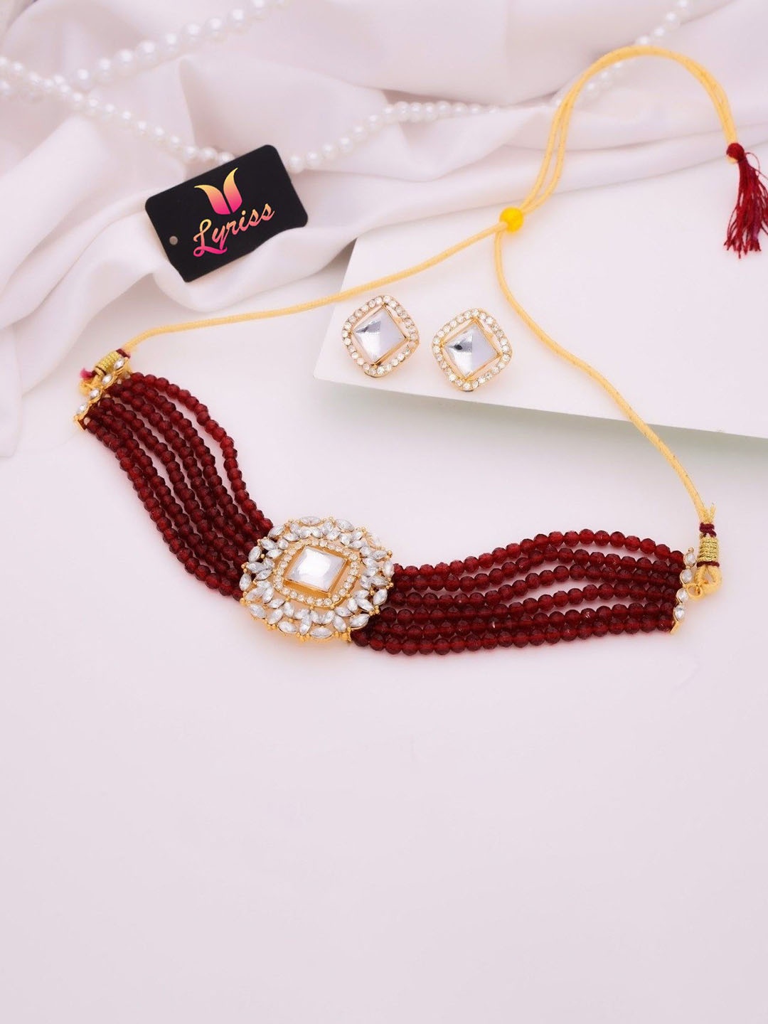 

Anouk Gold-Plated Artifical Stones Studded And Beaded Jewellery Set, Maroon