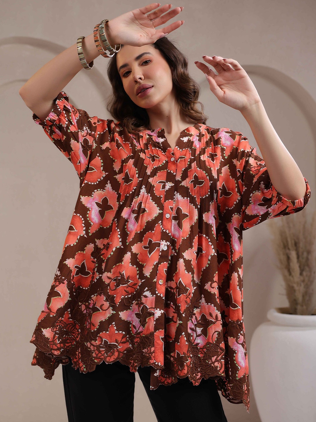 

Nyaro Women Rust Color Rayon Printed Top with Cut Work Embroidery