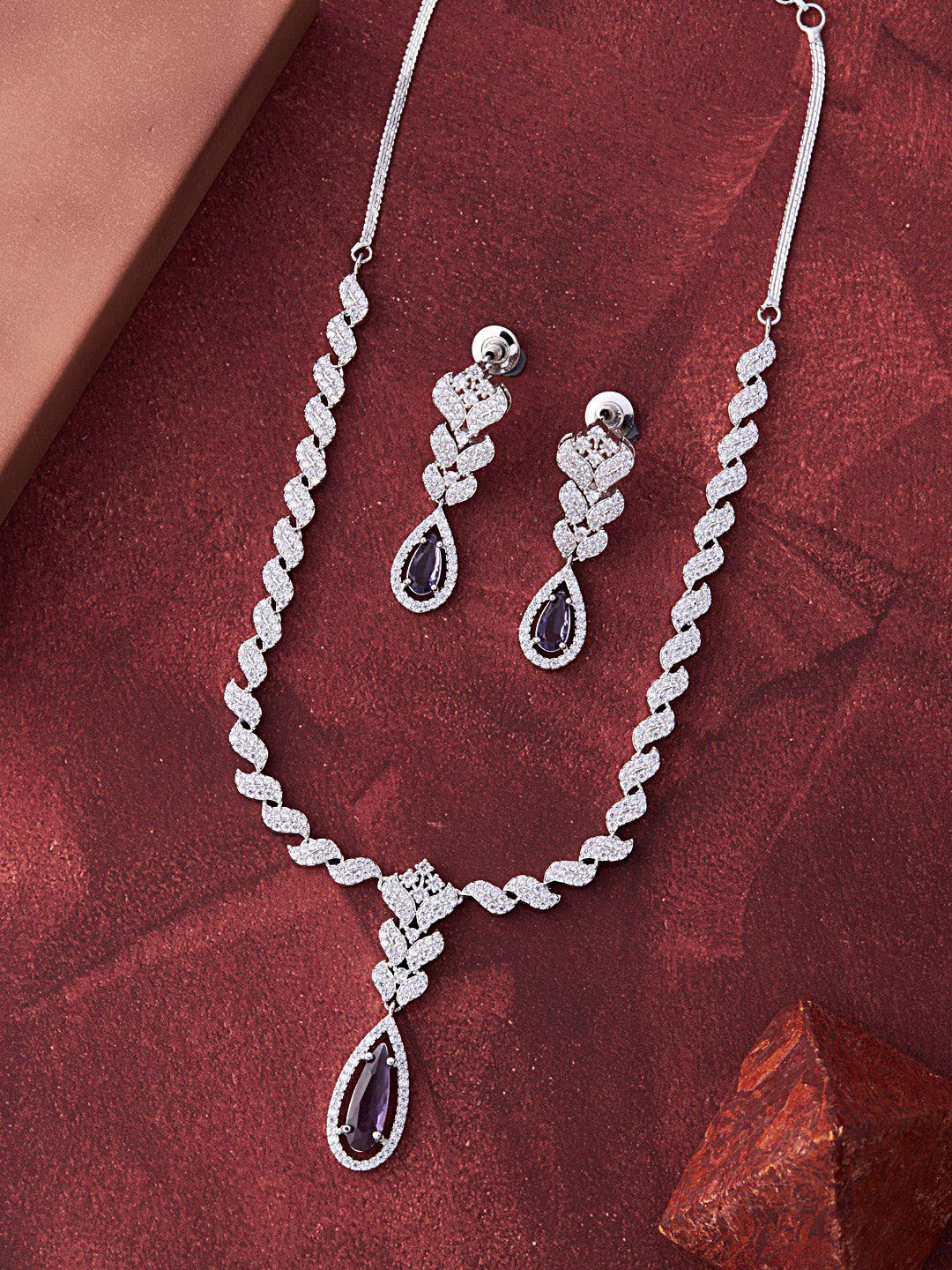 

Feelwhiz Silver-Plated American Diamond Studded Necklace and Earrings