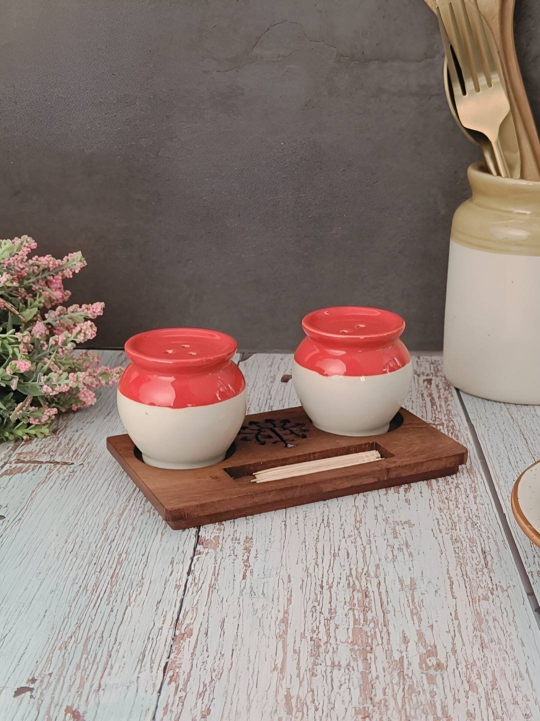 

Myntra Elegant Homes Red Ceramic Salt and Pepper Shakers With Wooden Toothpick Tray Holder