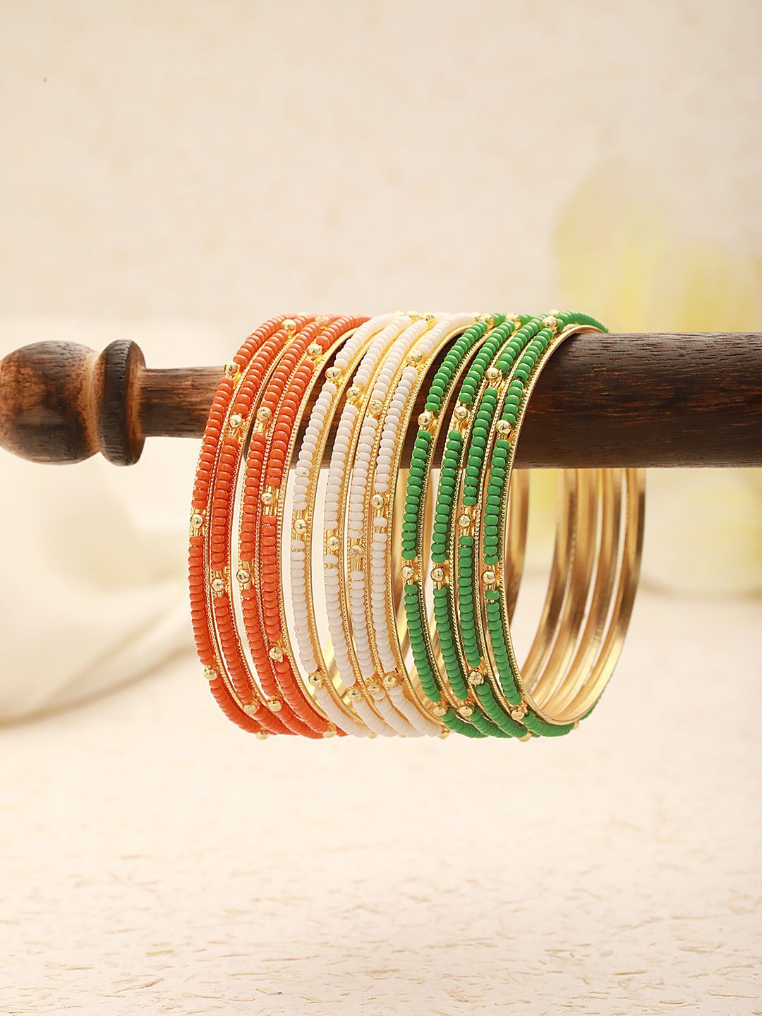 

Jazz and Sizzle Set Of 12 Gold-Plated Artificial Beaded Bangles