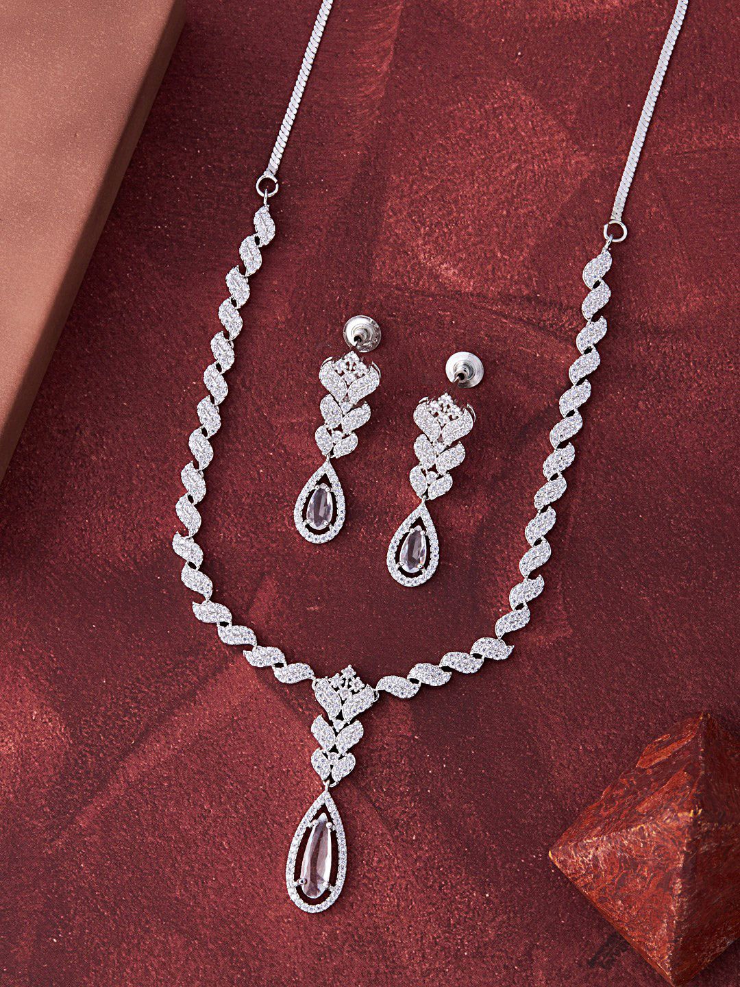 

Feelwhiz Silver-Plated American Diamond Studded Necklace and Earrings