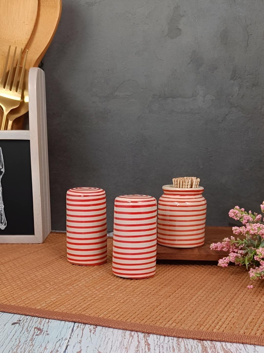 

Myntra Elegant Homes Red Striped Ceramic Salt and Pepper Shakers With Toothpick Holder