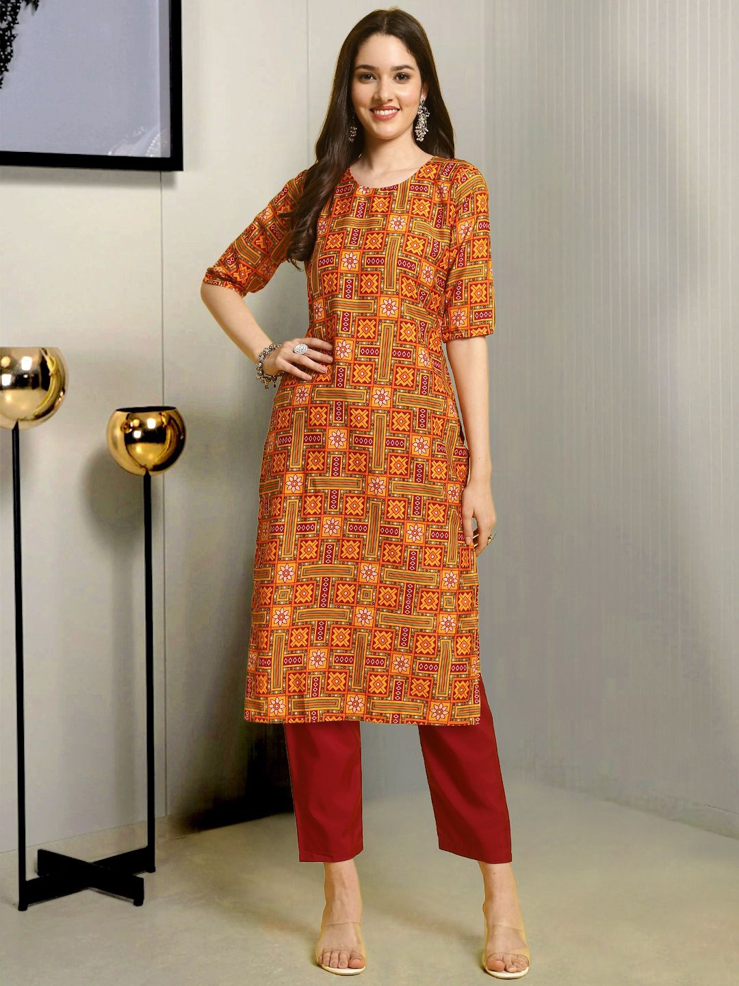 

Moda Rapido Ethnic Motifs Printed Round Neck Straight Kurta With Trousers, Orange