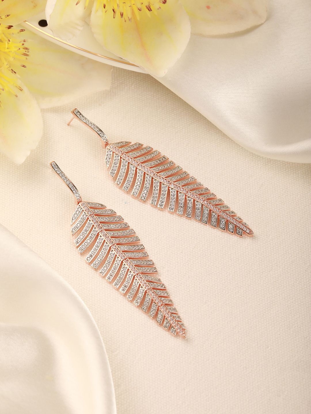 

Saraf RS Jewellery Rose Gold-Plated Zircon studded Feather Shaped Drop Earrings