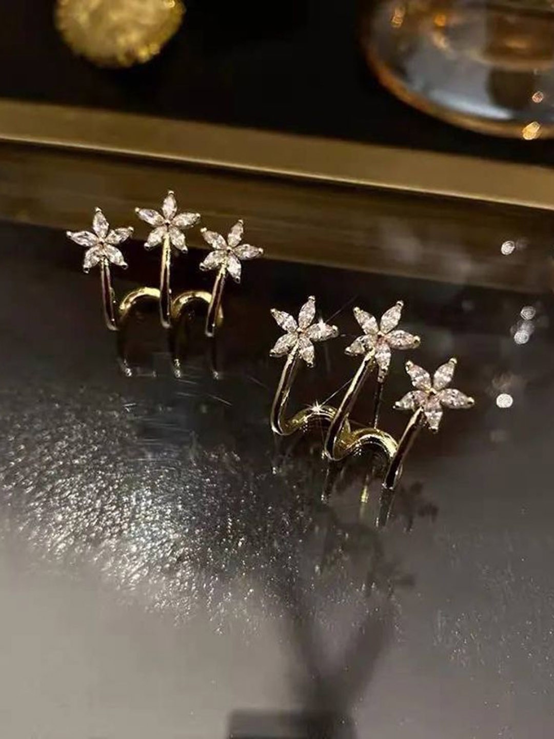 

Celestique Gold-Plated Cubic Zirconia Studded Contemporary Shaped Korean Studs