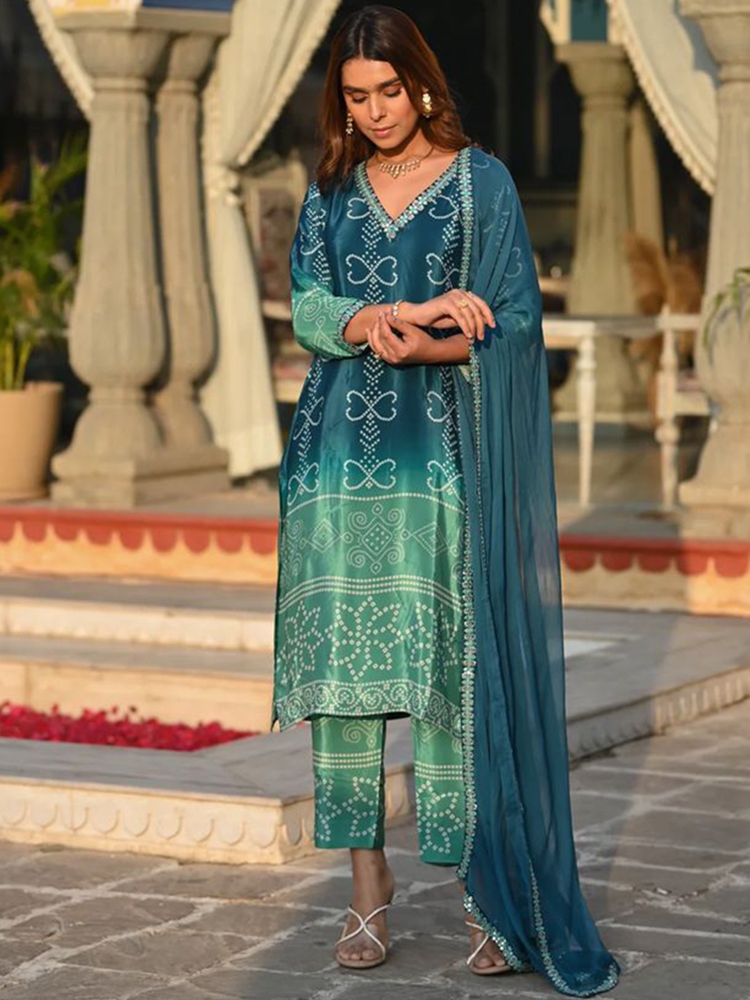 

Sitanjali Bandhani Printed Thread Work V-Neck Silk Chiffon Kurta With Trousers & Dupatta, Teal