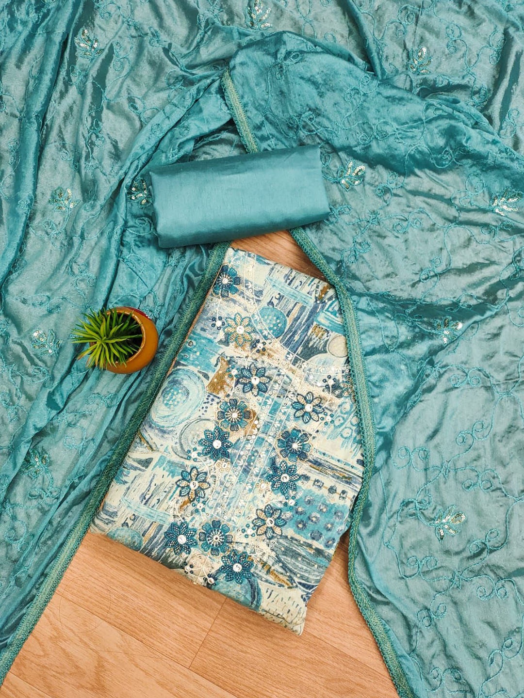 

Rangtulika Ethnics Abstract Printed Thread Work Unstitched Dress Material, Blue