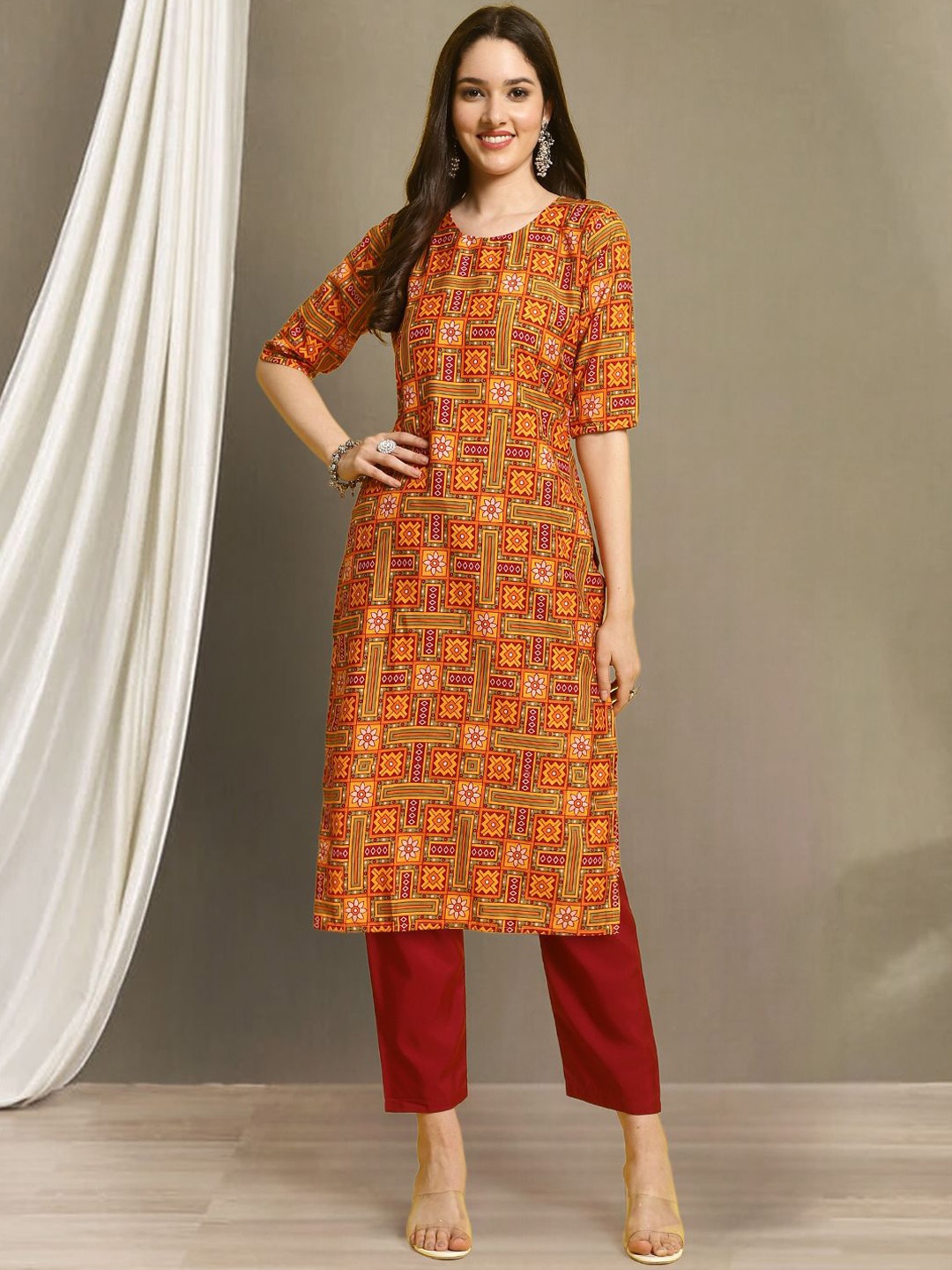 

Moda Rapido Ethnic Motifs Printed Round Neck Straight Kurta With Trousers, Orange