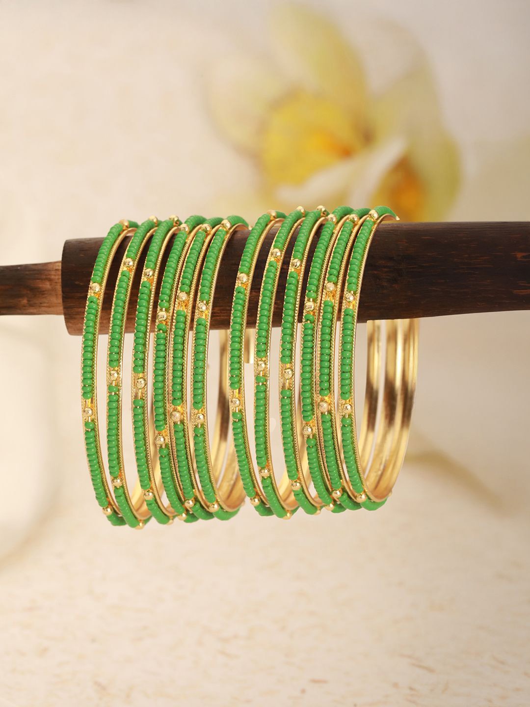 

Jazz and Sizzle Set Of 12 Gold-Plated Artificial Beaded Bangles