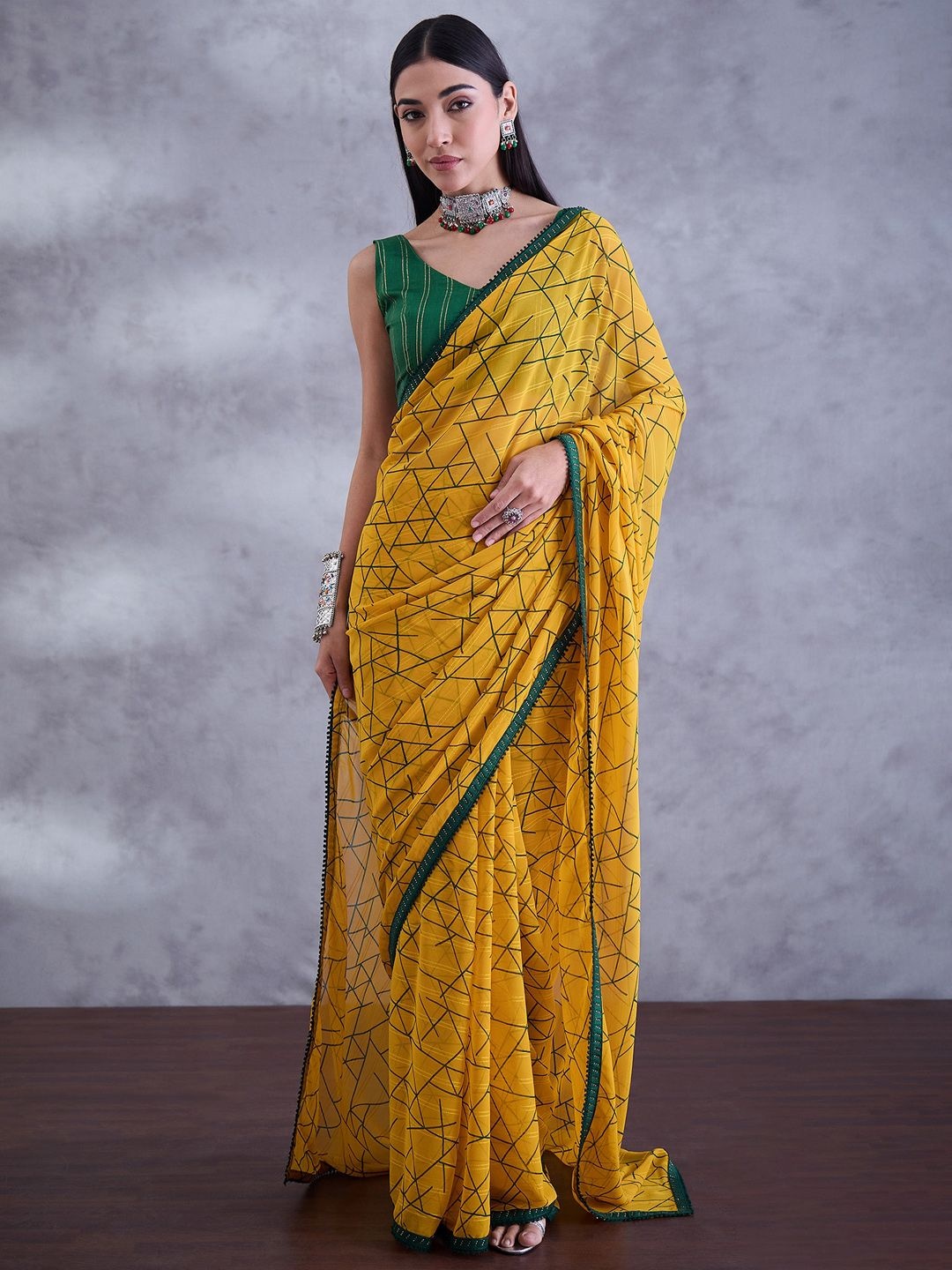 

Mitera Beads and Stones Pure Georgette Saree, Yellow