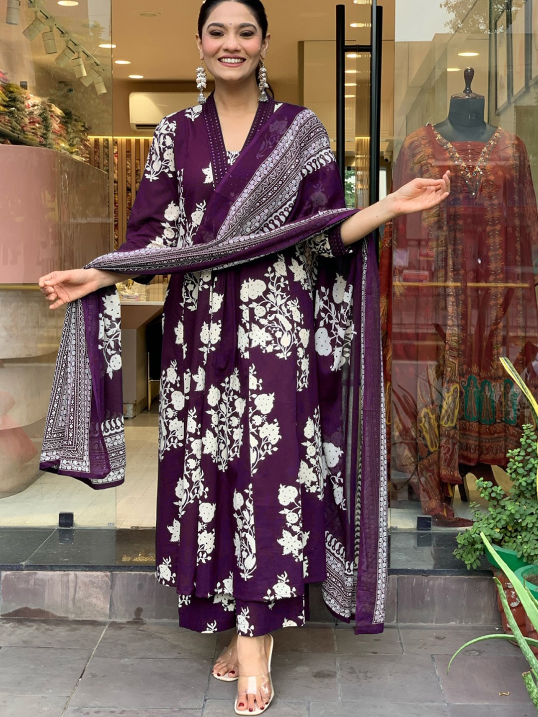 

KERI PERRY Floral Printed V-Neck Mirror Work A-Line Kurta With Palazzos & Dupatta, Purple