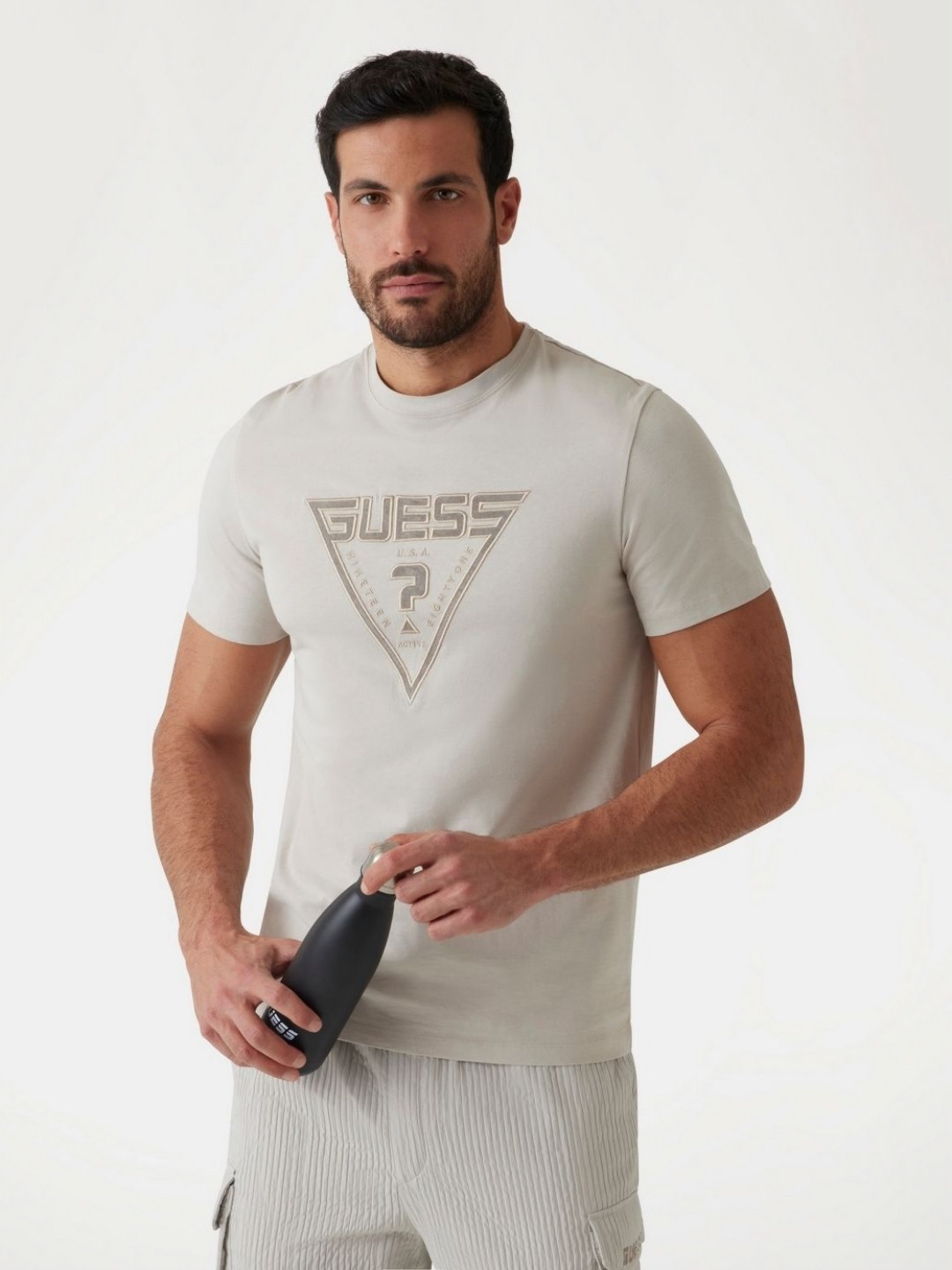 

GUESS Men Brand Logo Printed Pockets T-shirt, Beige