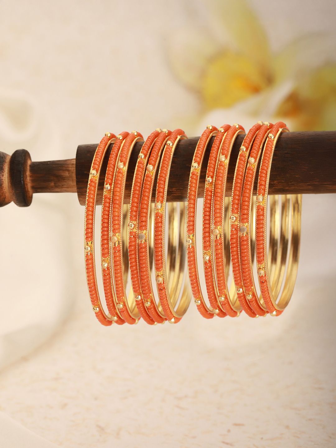 

Jazz and Sizzle Set Of 12 Gold-Plated Artificial Beaded Bangles