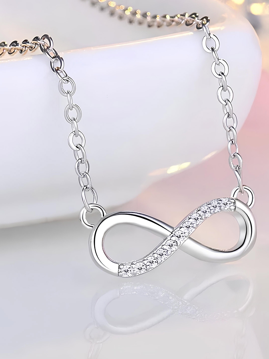 

KARISHMA KREATIONS Silver-Plated Crystal Stones Studded Infinity Pendant With Chain