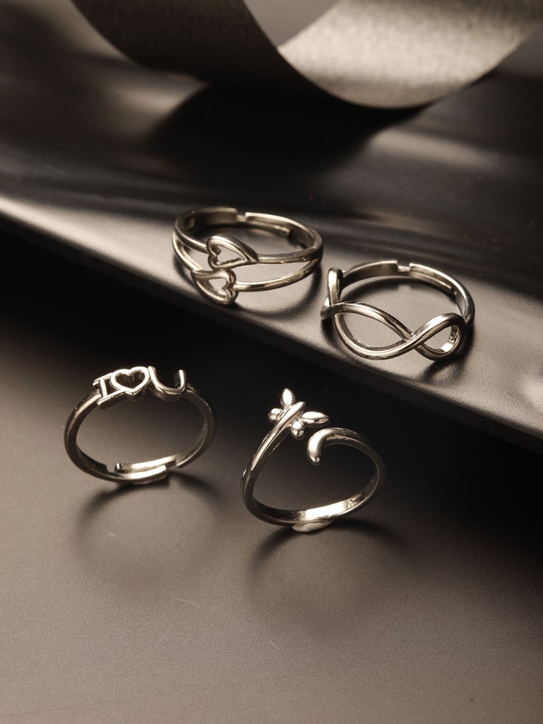 

Jazz and Sizzle Silver-Plated Set Of 4 Stainless Steel Adjustable Finger Rings