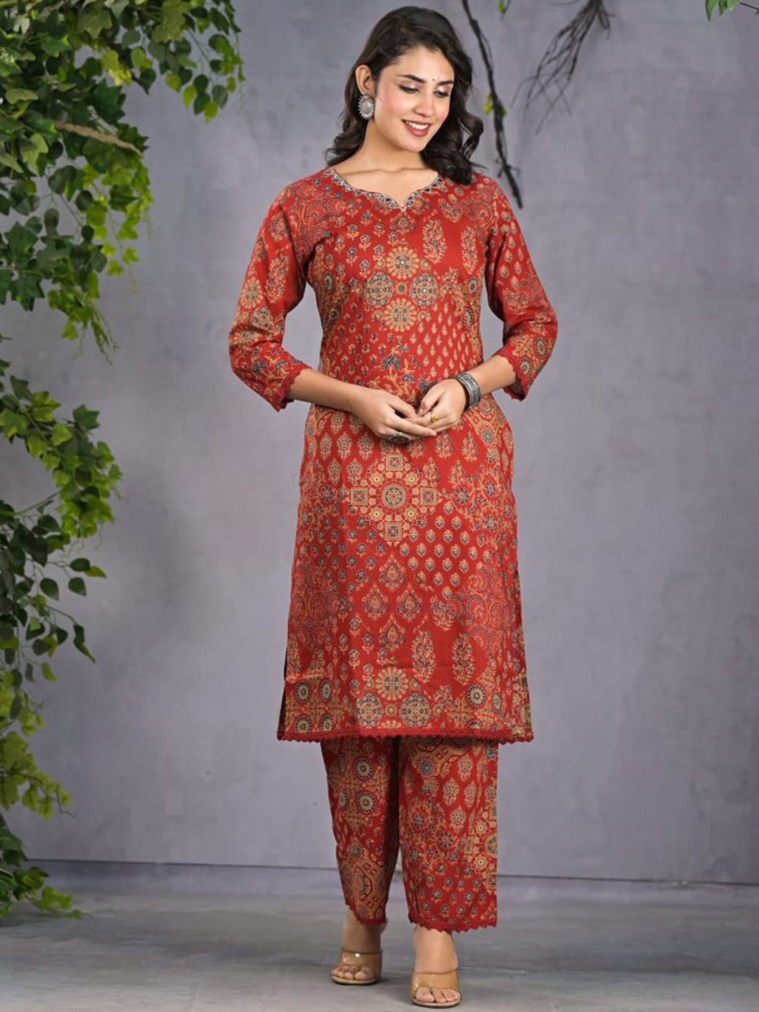 

Meena Bazaar Ethnic Motifs Printed Mirror Work Straight Kurta With Trouser, Red