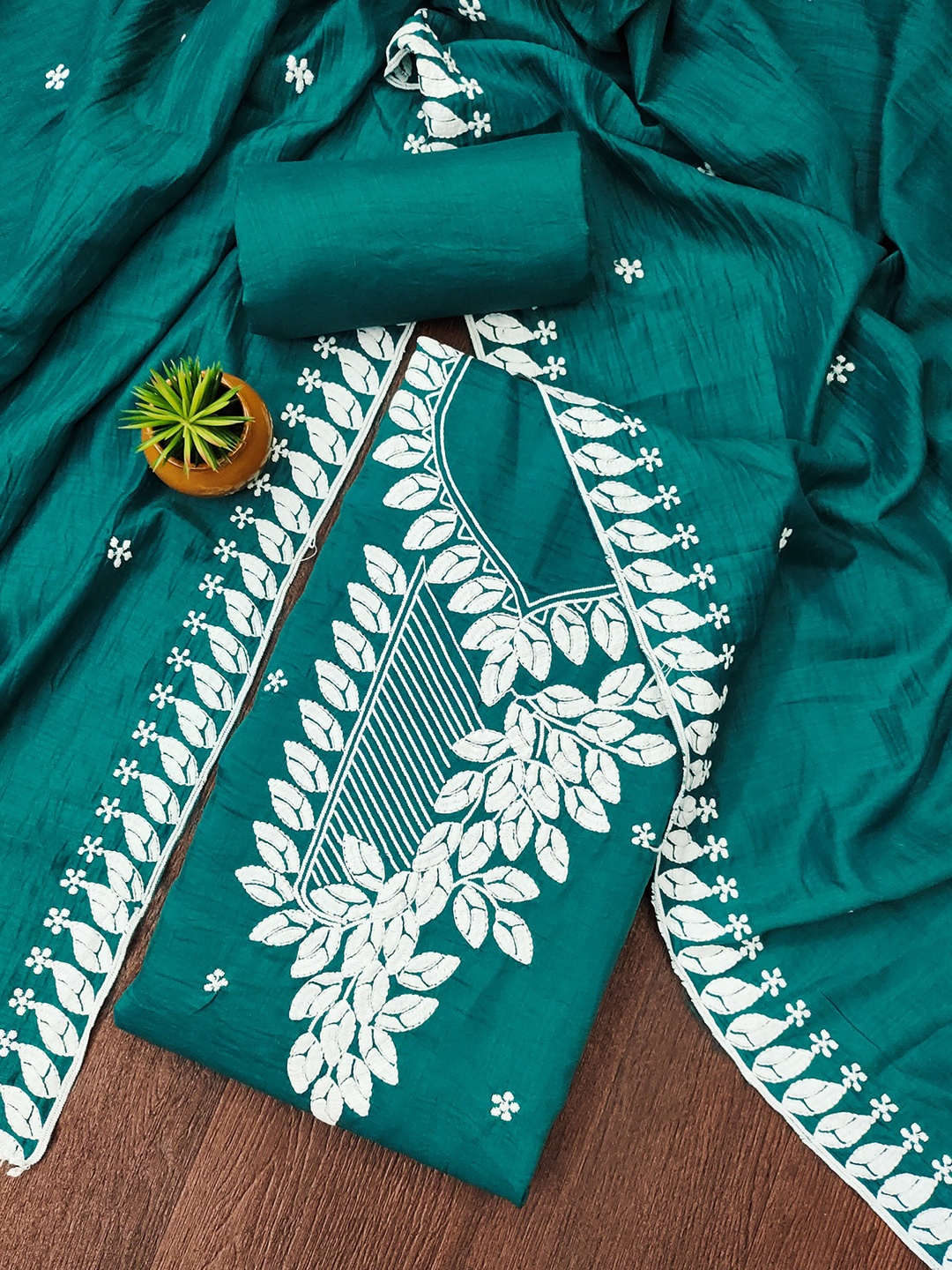 

Rangtulika Floral Embroidered Thread Work Unstitched Dress Material, Teal