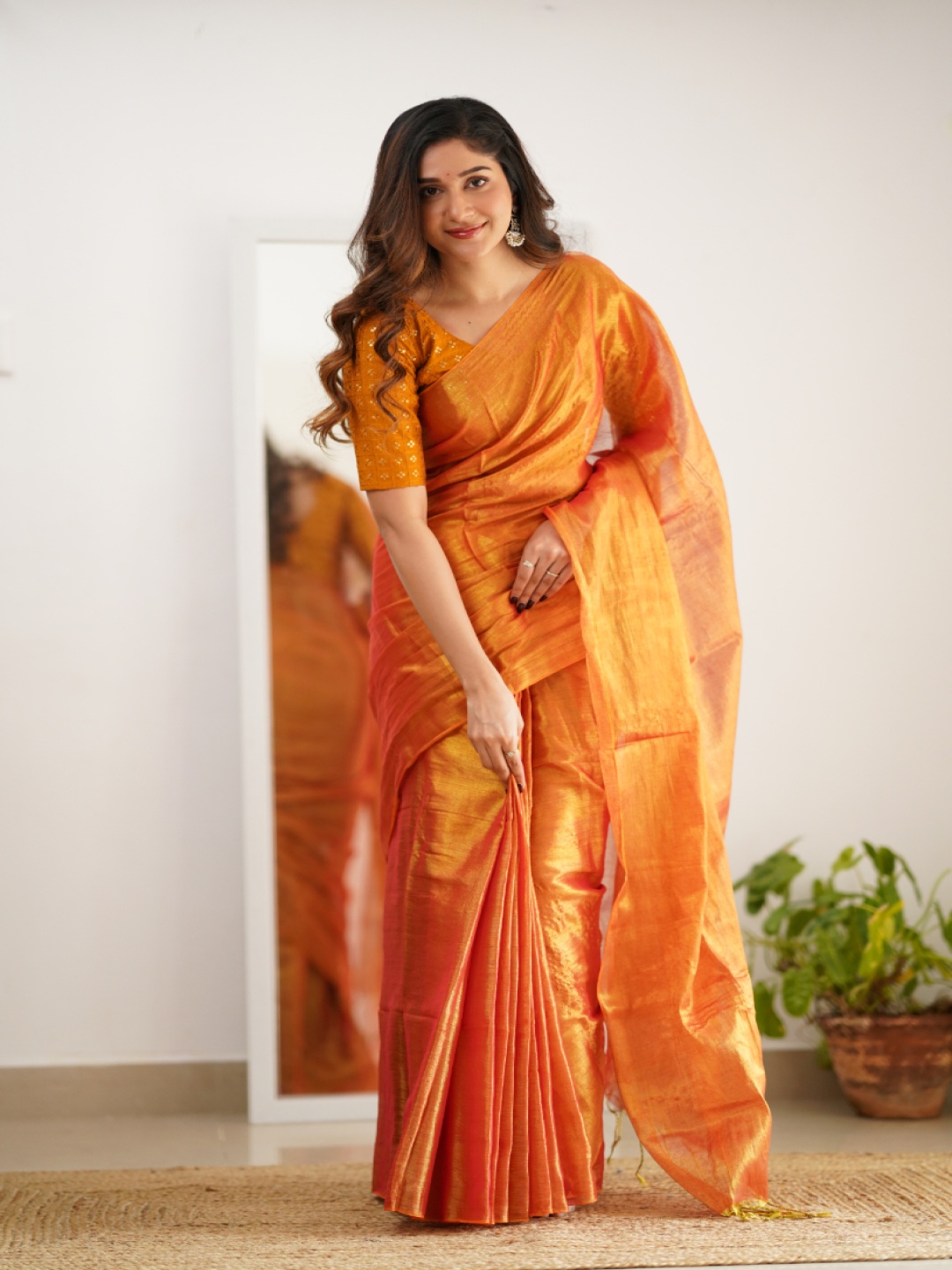 

Sutisancha Orange Handloom Tissue Saree With Designer Blouse
