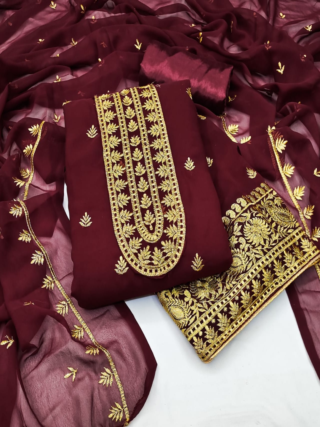

Rangtulika Ethnics Ethnic Motifs Zari Embroidered Unstitched Dress Material, Maroon