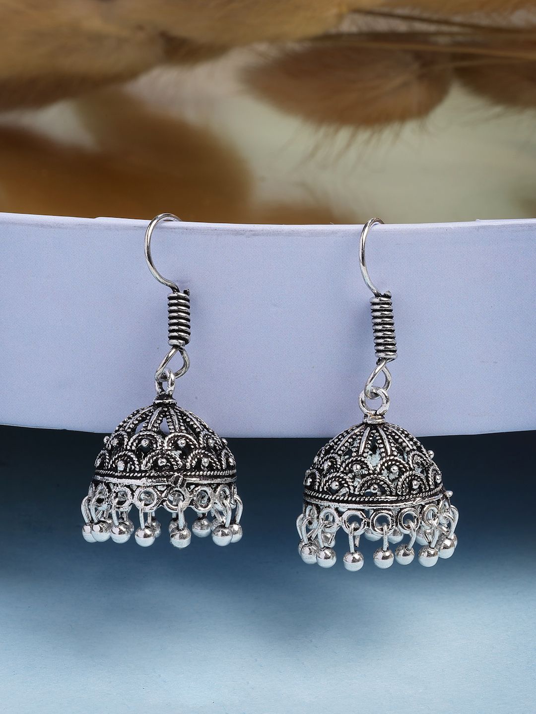 

NVR Women German Silver Silver Plated Jhumka Earrings