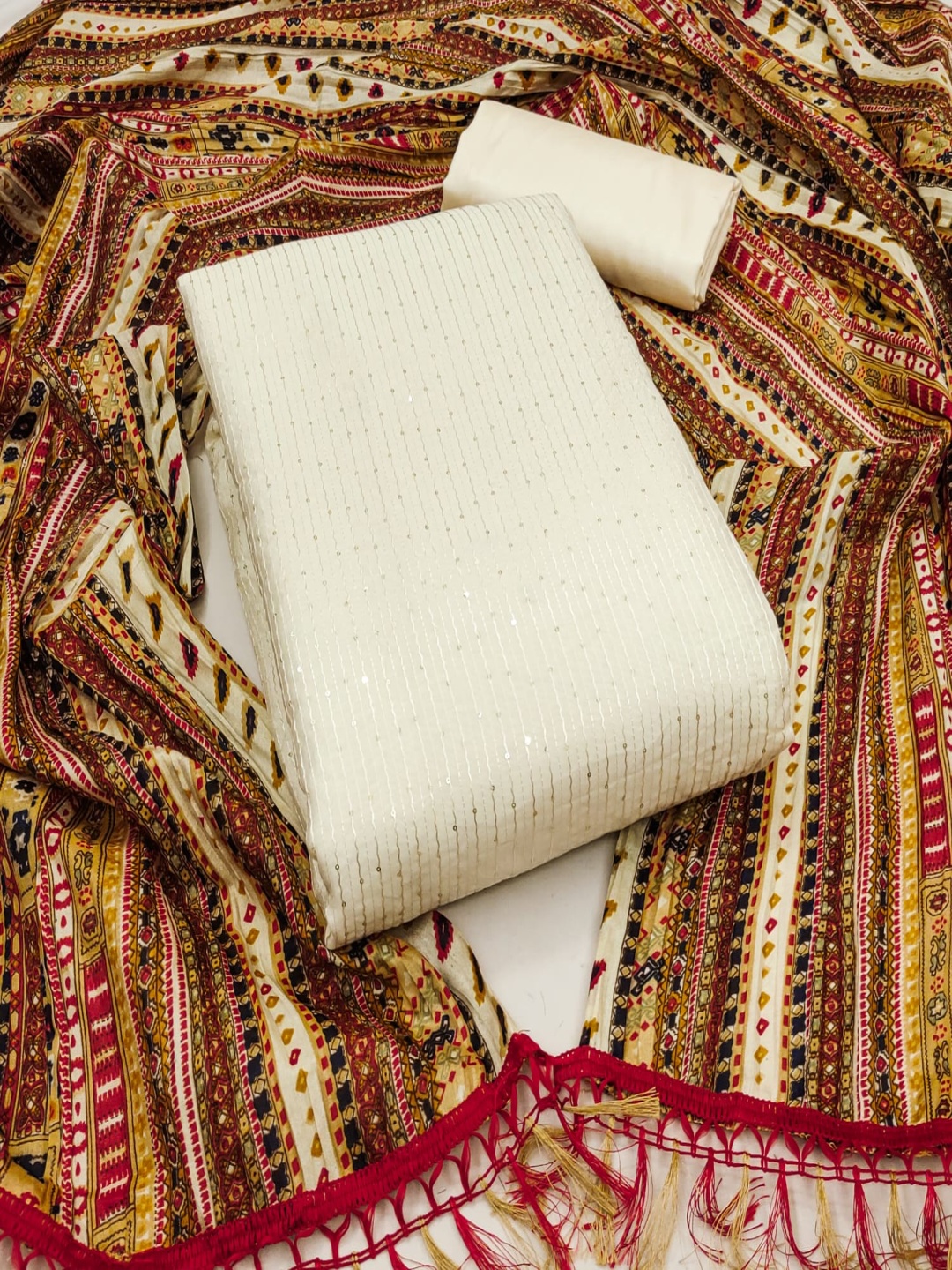 

Rangtulika Ethnics Striped Sequinned Embroidered Chanderi Unstitched Dress Material, Cream