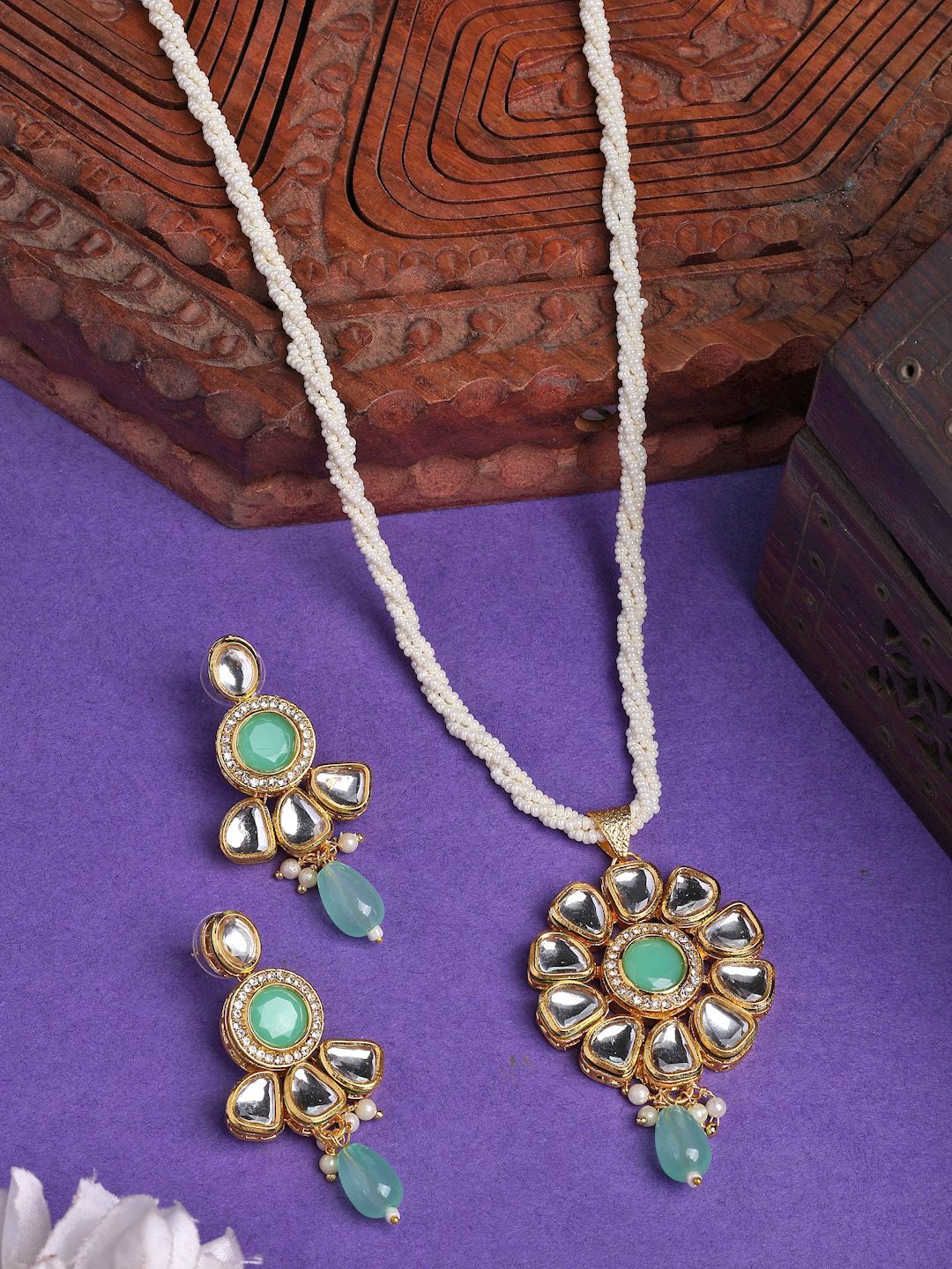 

NVR Women Gold Plated Kundan Studded & Pearls Beaded Long Jewellery Set