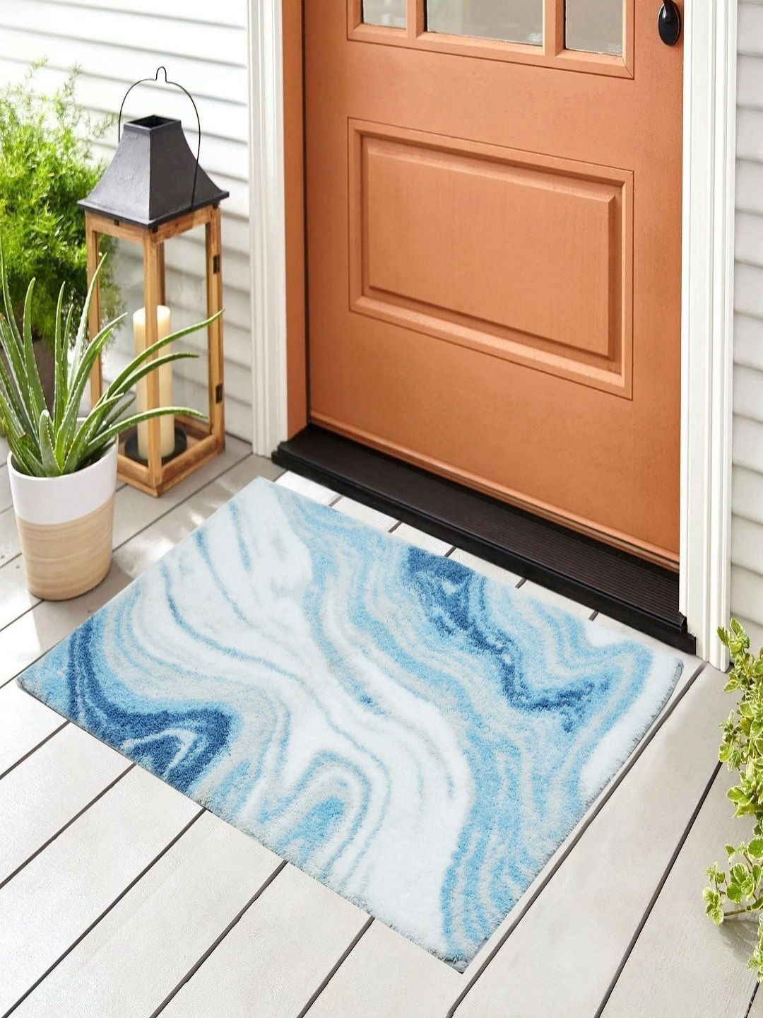 

Myntra Elegant Homes White & Blue Printed Anti Skid Bath Rug
