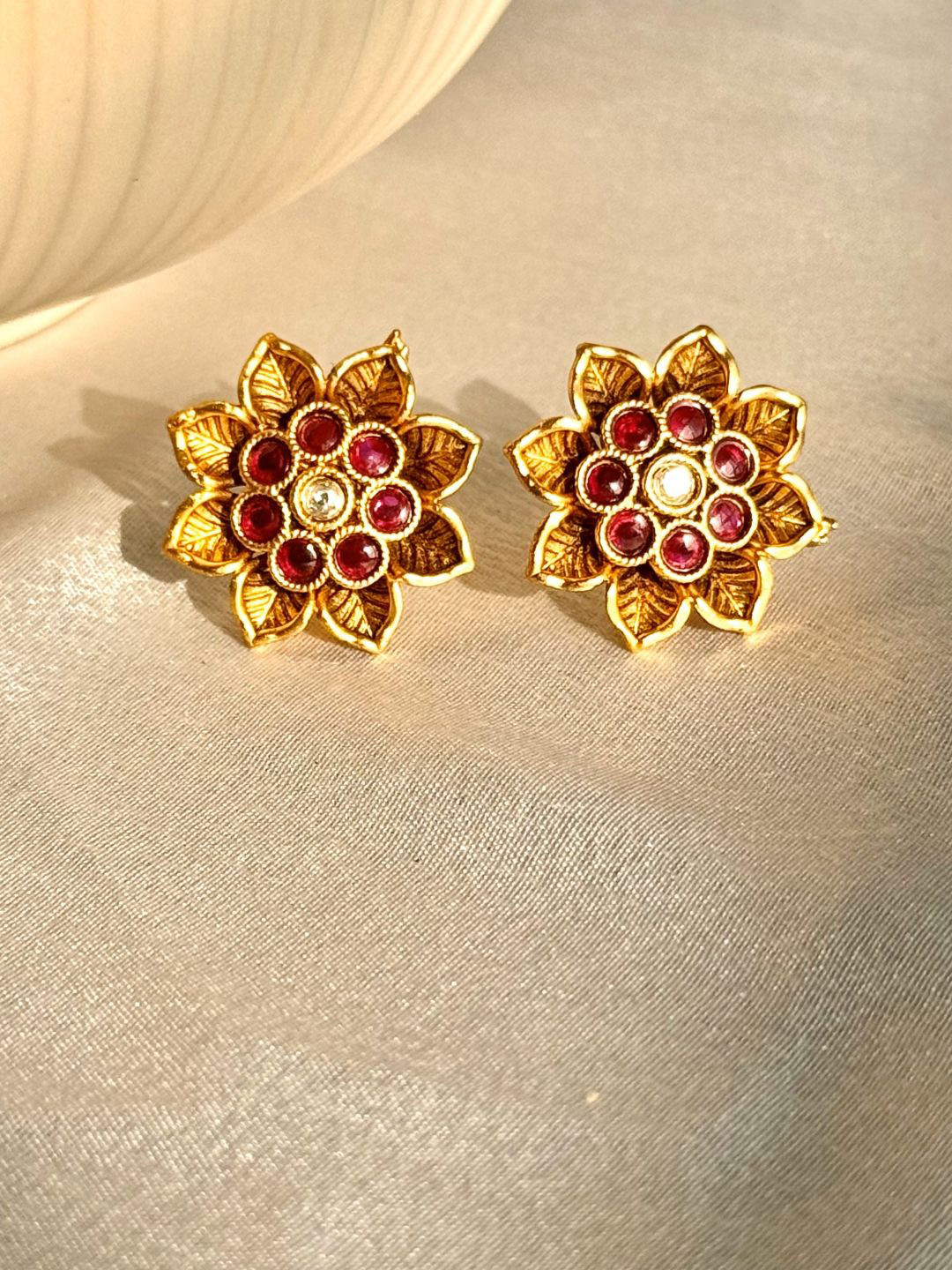

The Jewellery Tale Gold-Plated Stones Studded Floral Shaped Studs