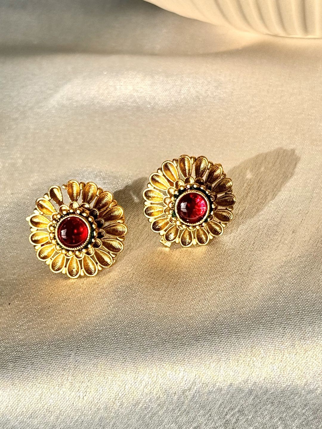

The Jewellery Tale Gold-Plated Stones Studded Floral Shaped Studs