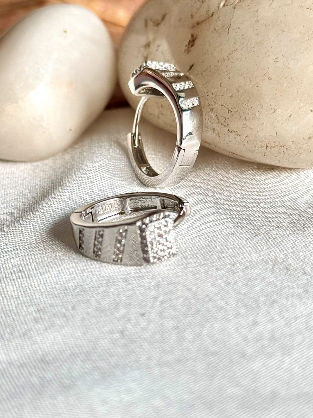 

The Jewellery Tale Silver-Plated Stones Studded Contemporary Shaped Half Hoop Earrings