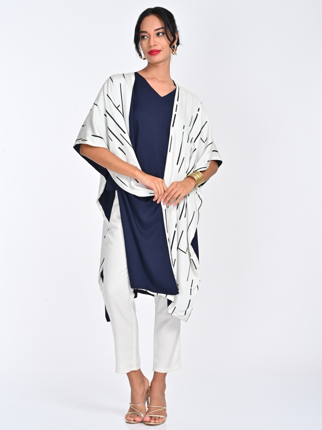 

Saltpetre Women Cream Cedar Print Cape With Navy V Neck Top & Pant Co-Ords, Navy blue
