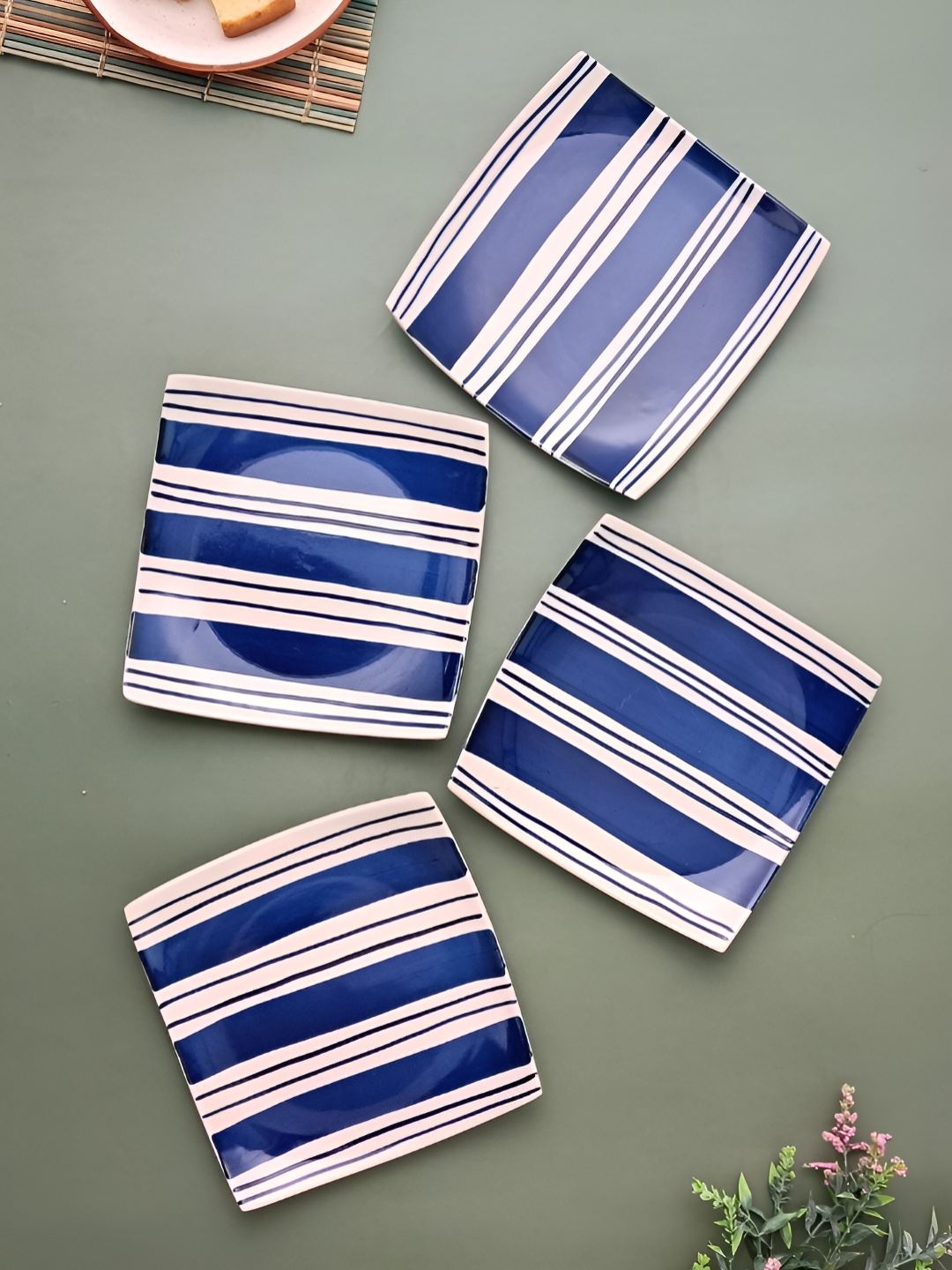 

Myntra Elegant Homes Blue & White 4 Pieces Ceramic Hand-Painted Food Platter