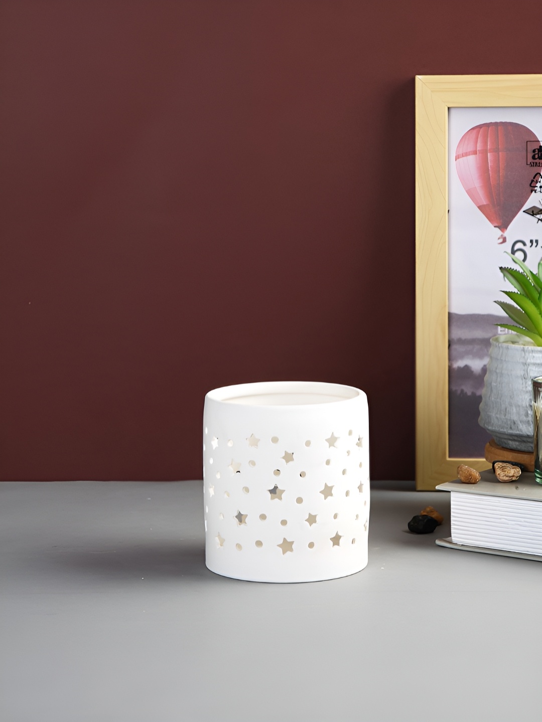 

Myntra Elegant Homes White Candle Holder