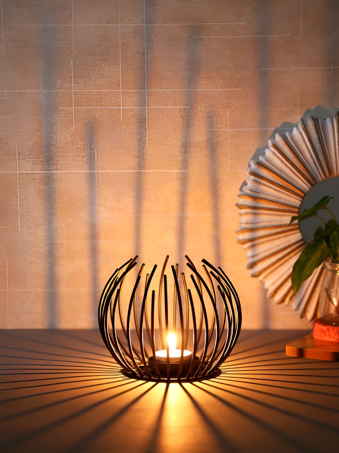 

Myntra Elegant Homes Black Candle Holder