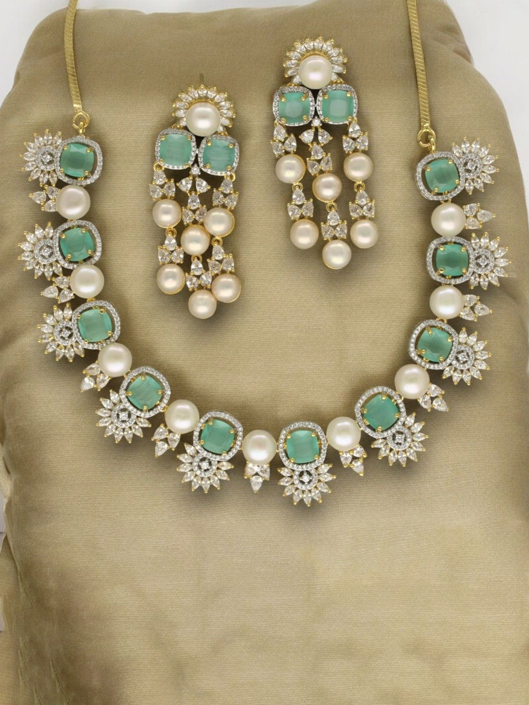 

Sri Jagdamba Pearls Dealer Gold-Plated Pearls Studded Regal Glory Jewellery Set