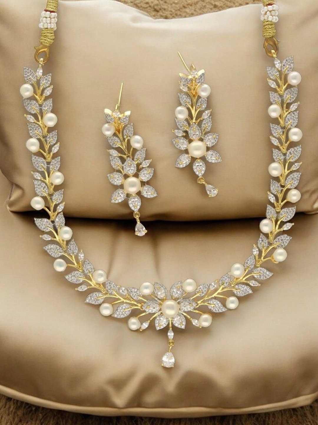 

Sri Jagdamba Pearls Dealer Majesty Aurora Gold-Plated Pearls Studded Jewellery Set