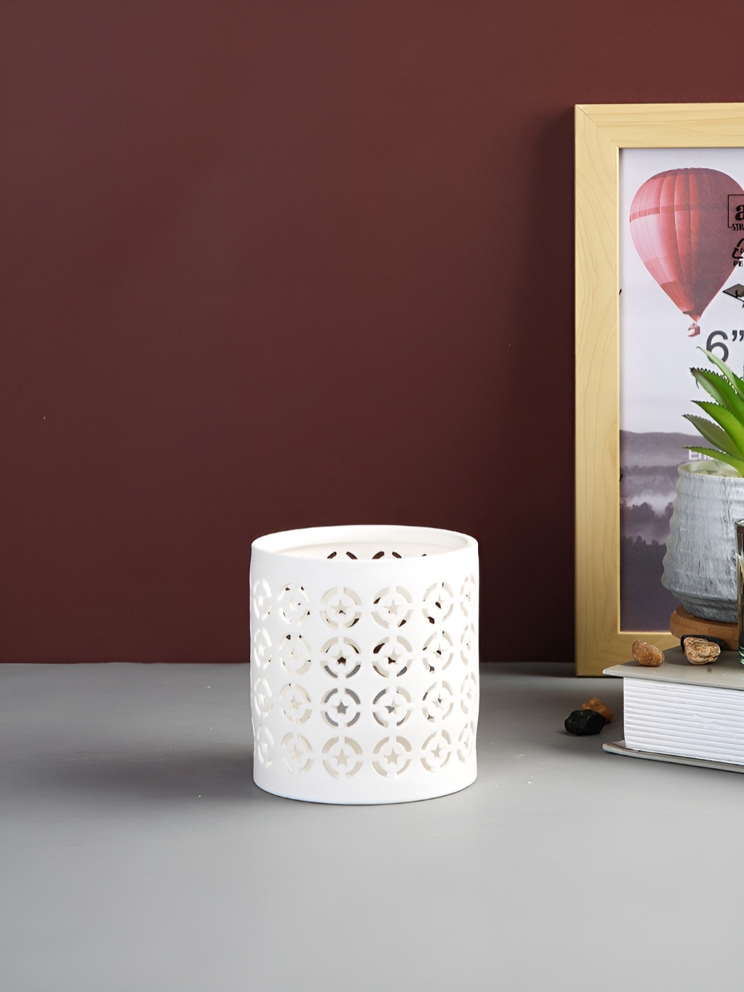 

Myntra Elegant Homes White Candle Holder