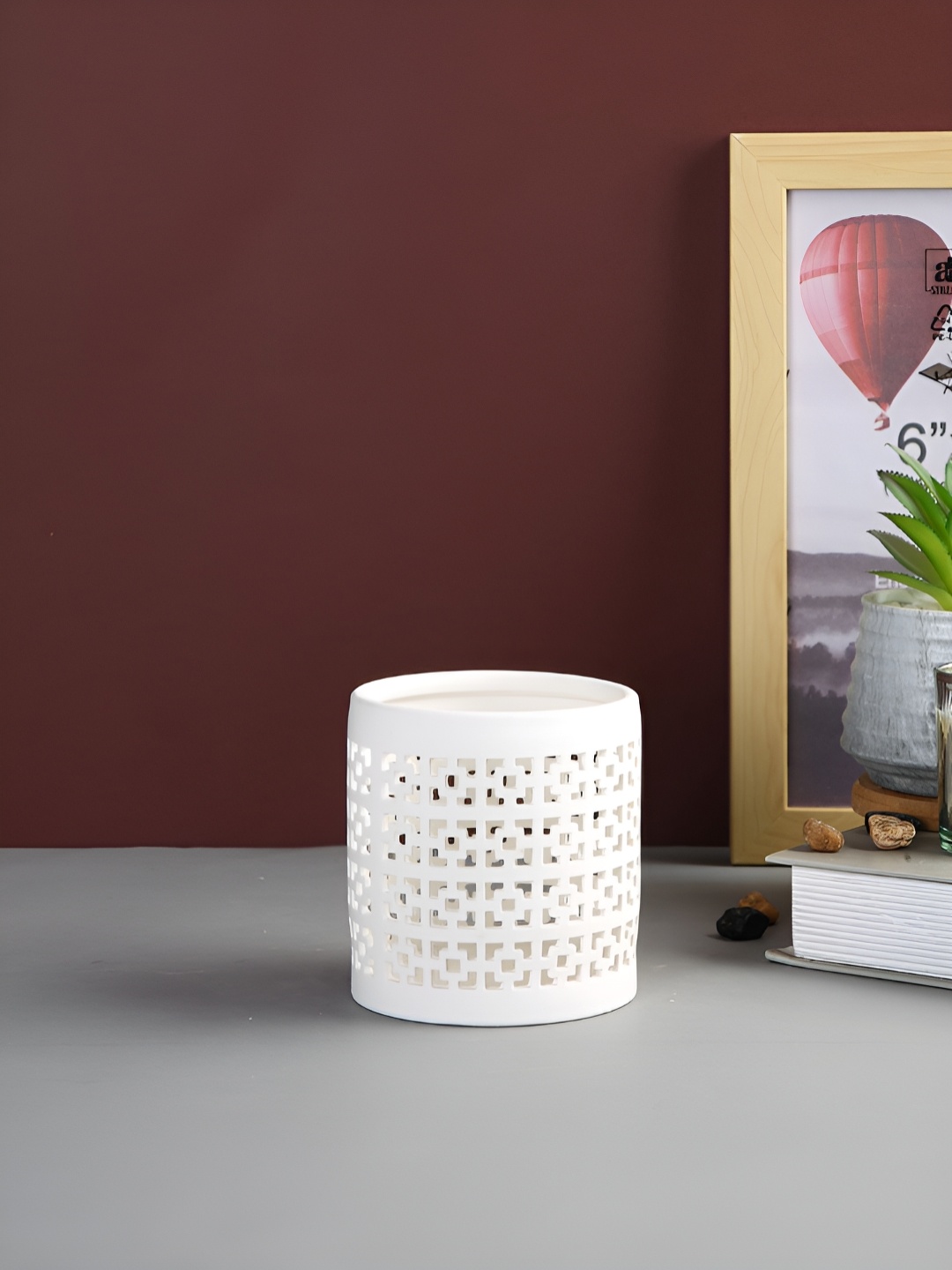 

Myntra Elegant Homes White Candle Holder