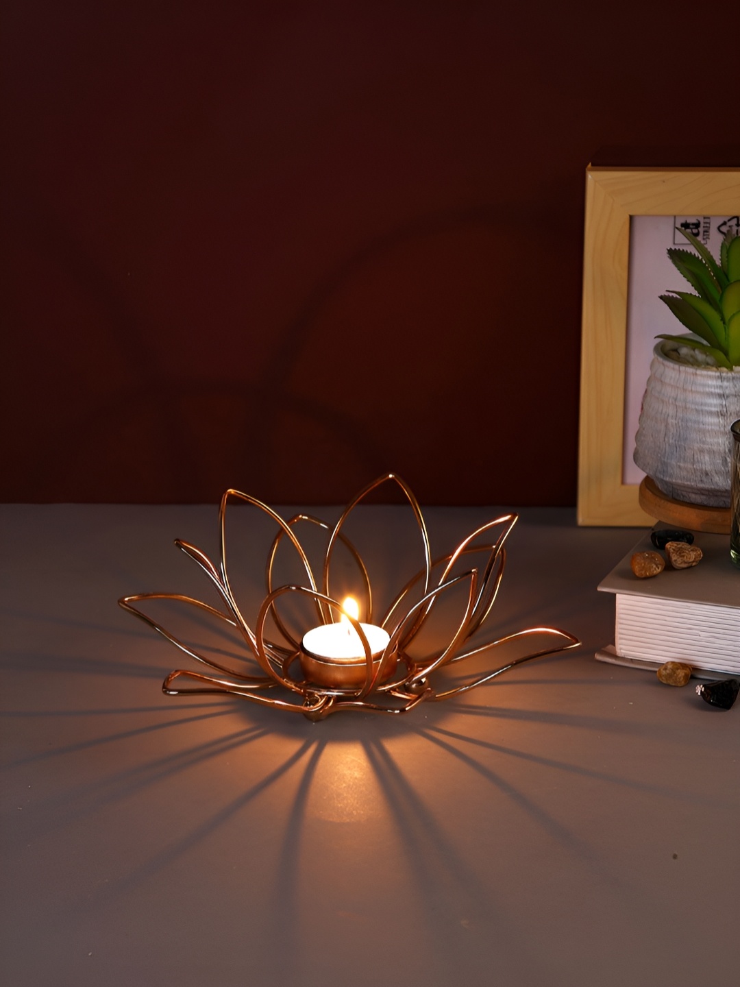 

Myntra Elegant Homes Gold-Toned Candle Holder