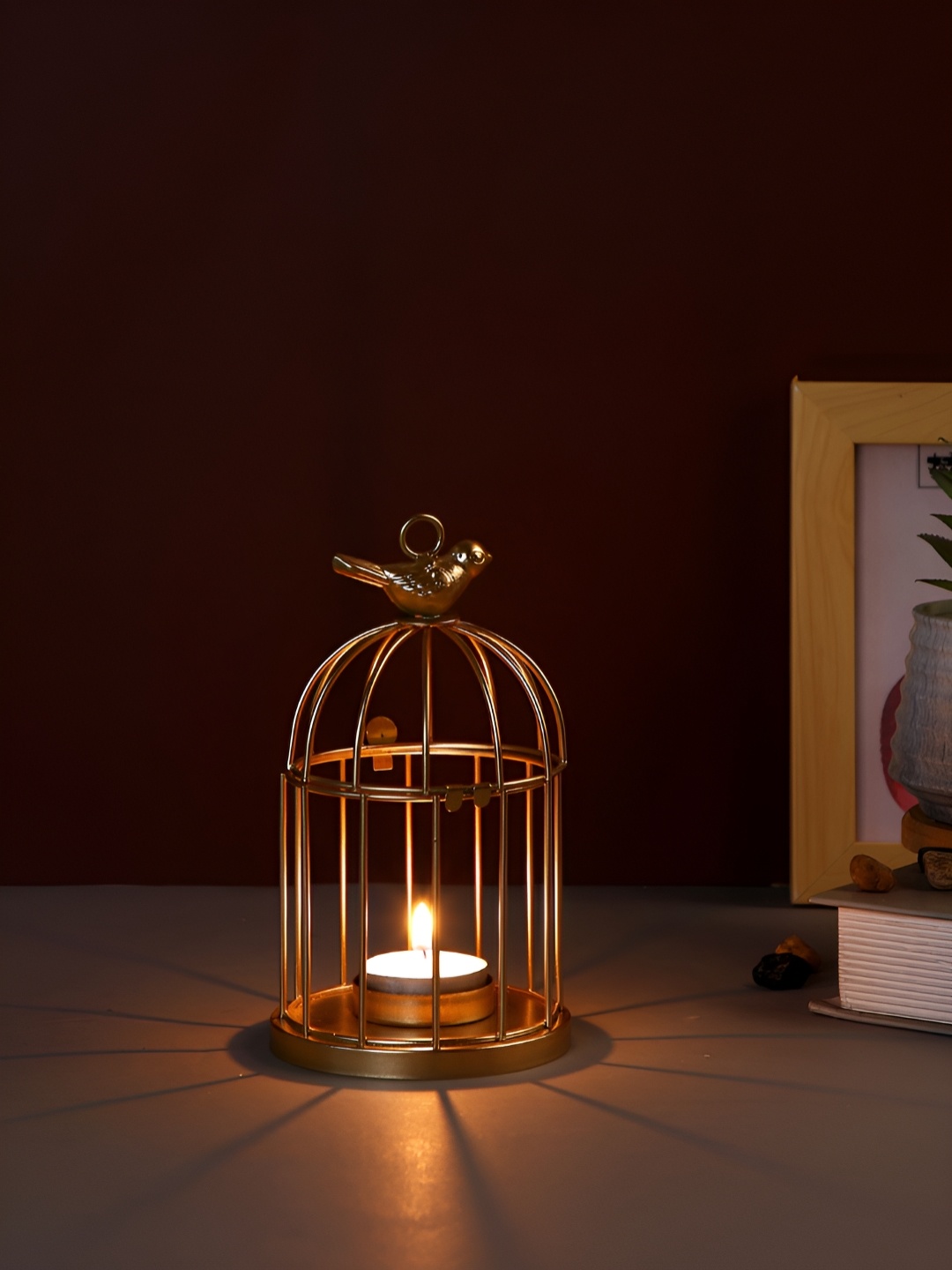 

Myntra Elegant Homes Gold-Toned Candle Holder