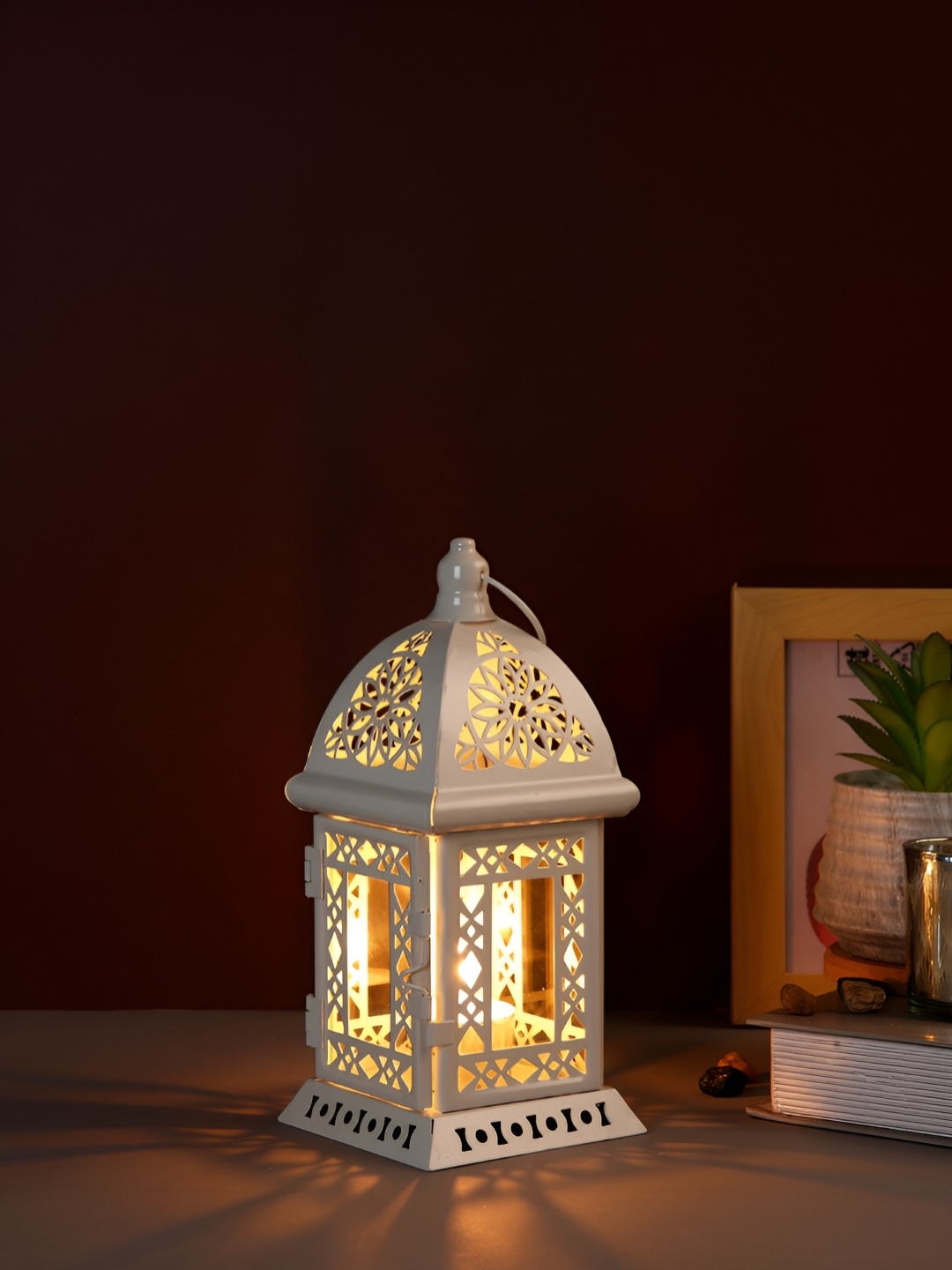 

Myntra Elegant Homes White Candle Holder
