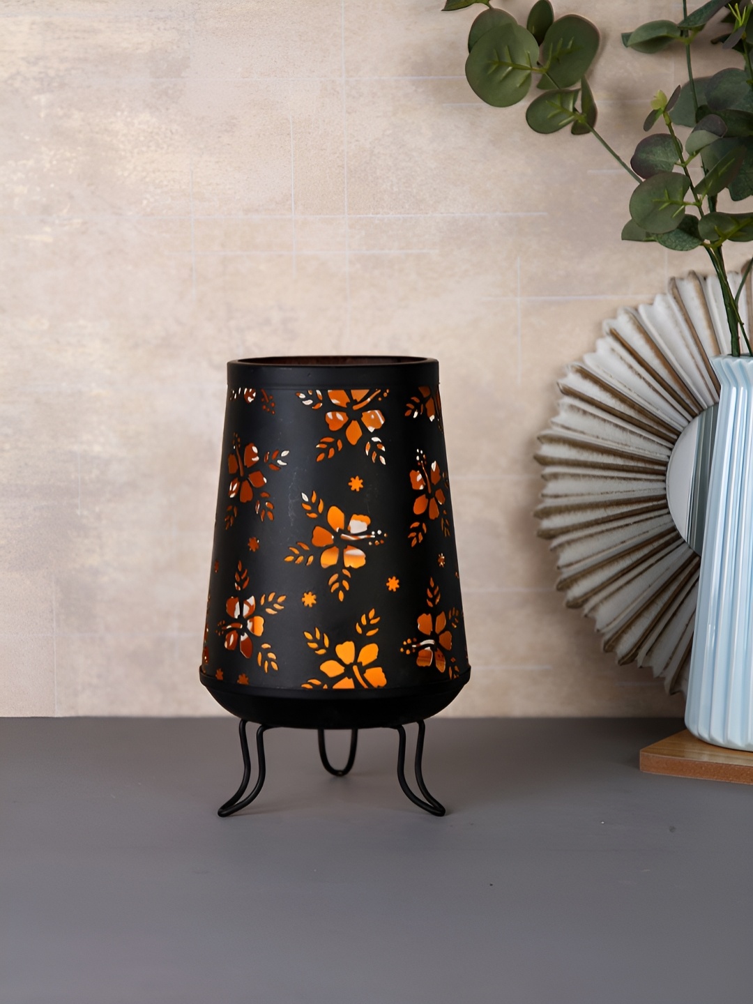

Myntra Elegant Homes Black & Brown Candle Holder