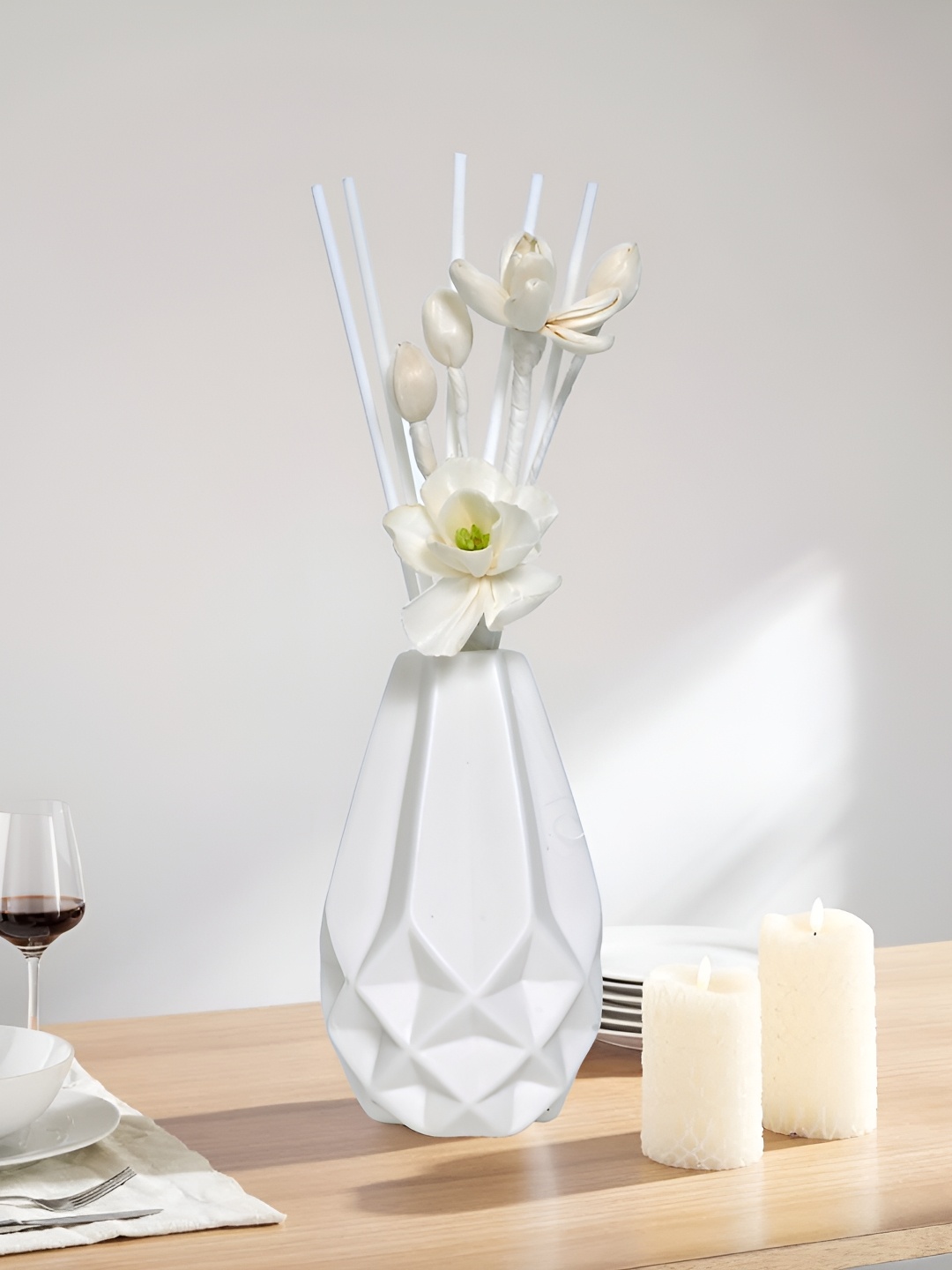 

Myntra Elegant Homes White Textured Ceramic FlowerVases