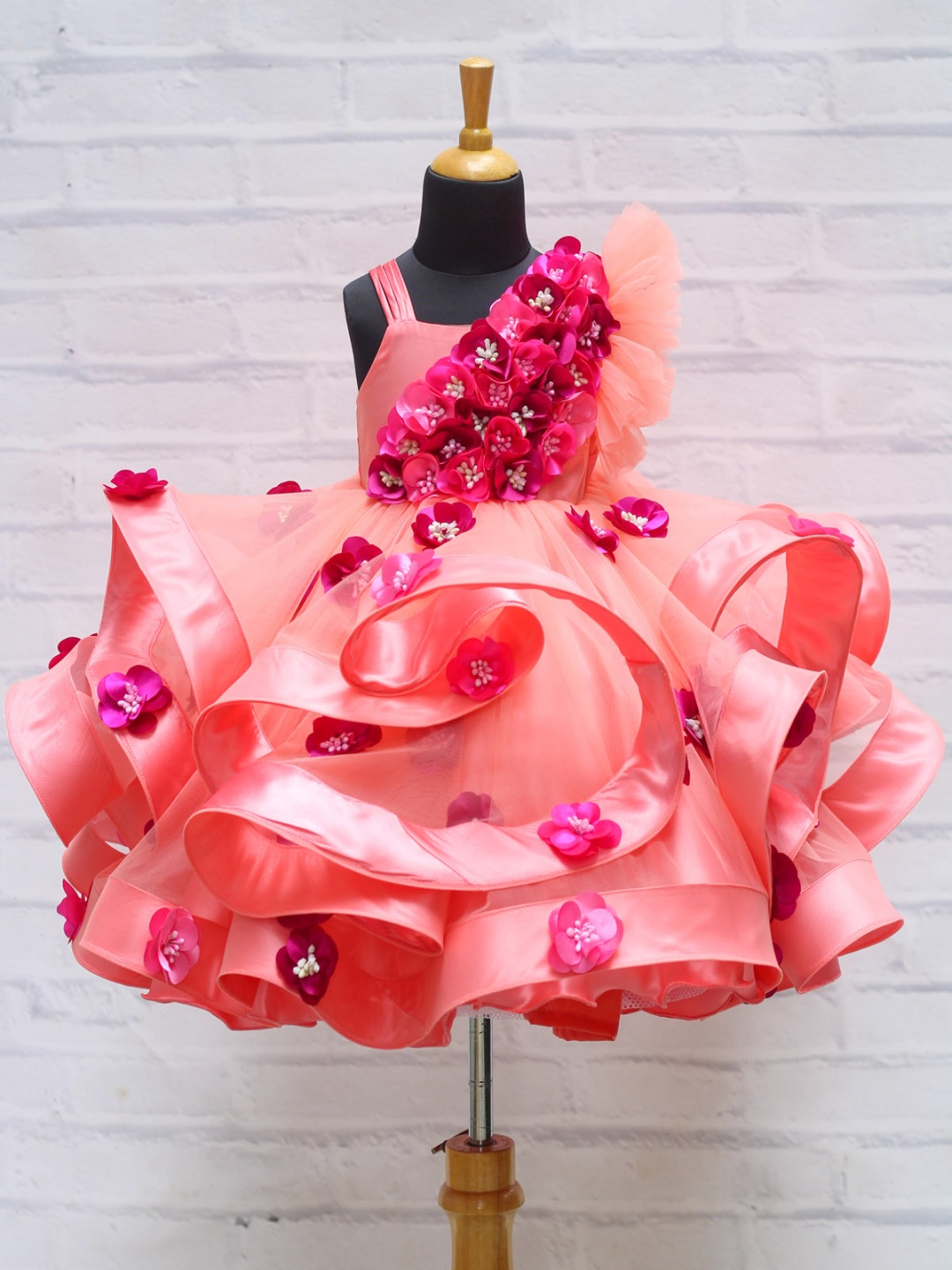 

Li & Li Girls Boutique Peach Color Twirled Frock Purple & Pink Shaded Hand Crafted Flowers