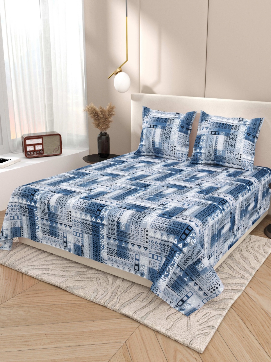 

Myntra Elegant Homes Blue & White Ethnic Motifs 220 TC King Bedsheet with 2 Pillow Covers